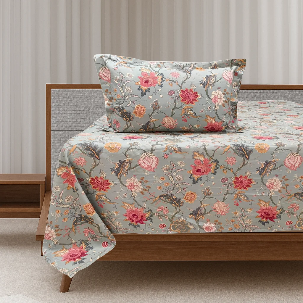Close-up view of vintage botanical bed sheet set showing detailed coral pink flowers and botanical branches on grey background, premium cotton bedding by Vardhman Mills with elegant vintage design