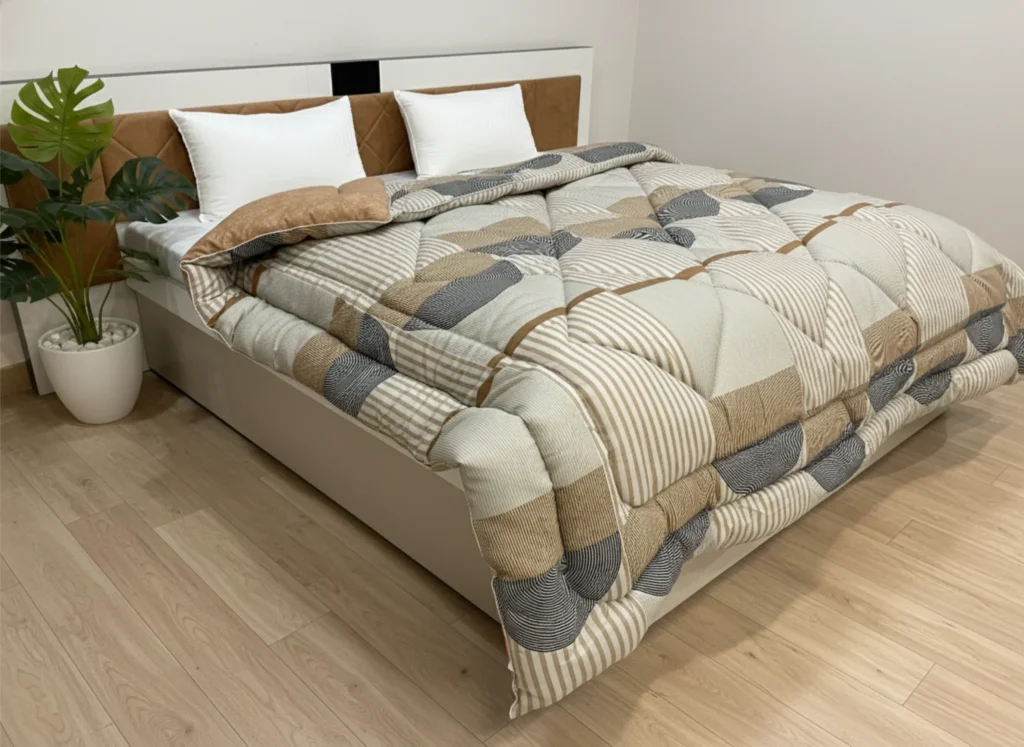 Beige patchwork heavy winter quilt rajai king size 4.5kg with neutral geometric block pattern by Vardhman Mills