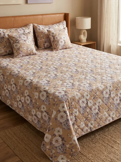 Beige Bloom cotton double bed cover on bed – quilted 100% cotton 300 TC with pillow and cushion covers by Vardhman Mills
