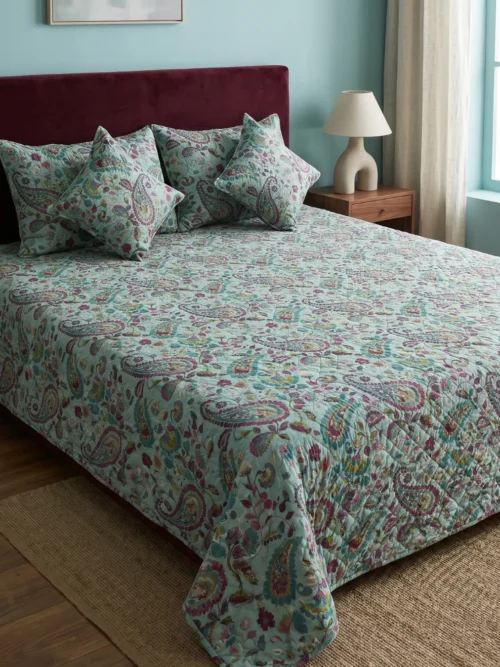 Teal Paisley printed bed cover on bed – quilted 100% cotton 300 TC with pillow and cushion covers by Vardhman Mills