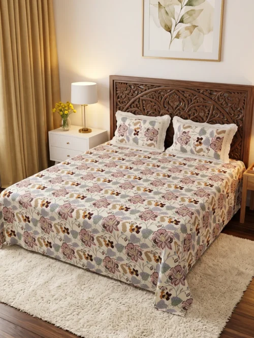 Wild Orchid anokhi bed sheets online, king size with mauve floral print on a wooden bed